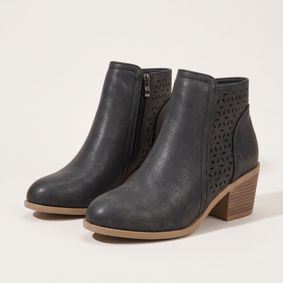 Women's cutout ankle boots in black, front view